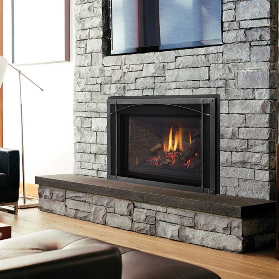 Modern gas fireplace installed in a St. Louis, MO living room with stone wall surround Modern gas fireplace installed in a St. Louis, MO living room with stone wall surround