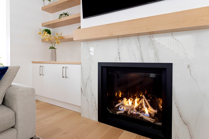 Contemporary gas direct vent fireplace built into a modern living space in the St. Louis Metro Area.
